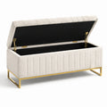 Panca contenitore in tessuto beige con struttura in metallo dorato