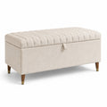 Panca contenitore in tessuto beige con gambe in legno